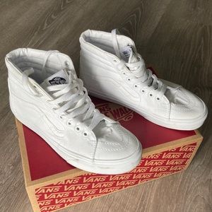 All white Sk8-Hi vans